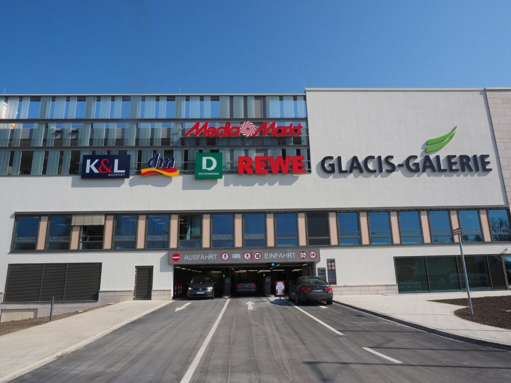 View of Glacis-Galerie shopping center entrance with parking access.